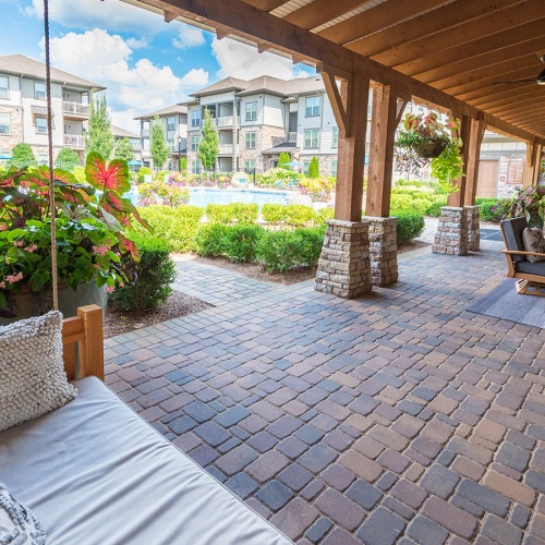 Outdoor seating area near flowers and gazebo