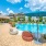 Poolside with lounge areas and umbrellas