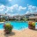 Poolside with floors and chairs in the water
