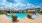 Poolside with floors and chairs in the water