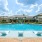 Pool near leasing center with reclining chairs