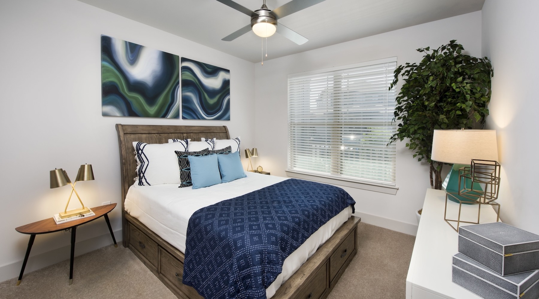 a bedroom with a bed and two nightstands