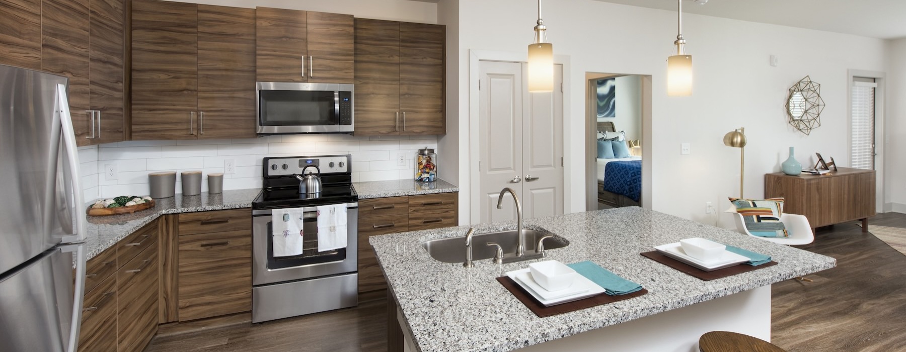 a kitchen with a marble island