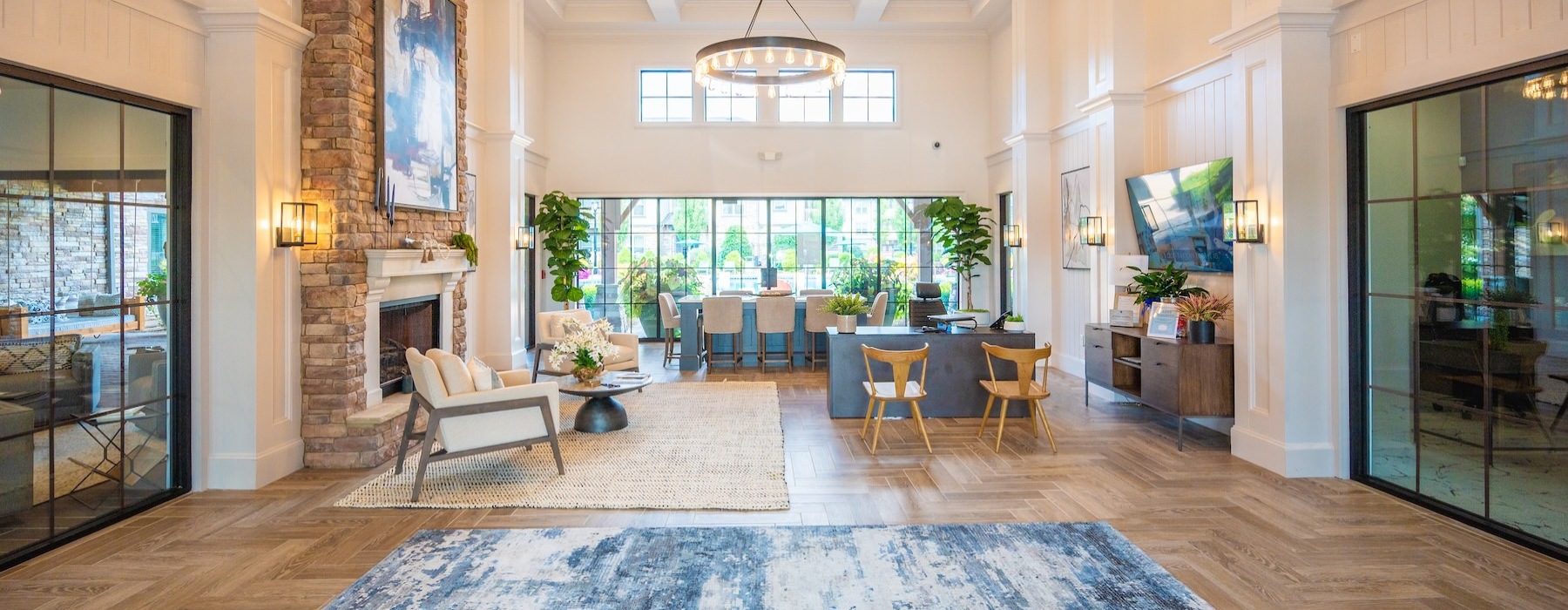 a clubroom with tables, chairs and a rug