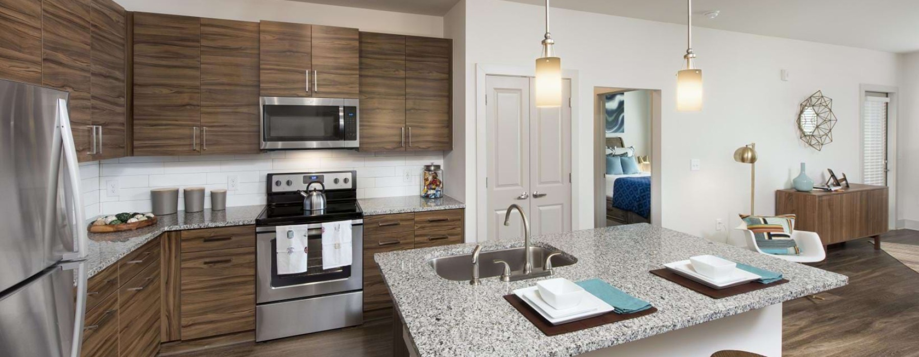 a kitchen with a marble island